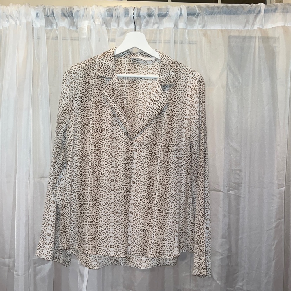 All In Favor long sleeve cheetah print shirt. Cute for the office or brunch.